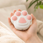Pink pet steam brush close-up in hand